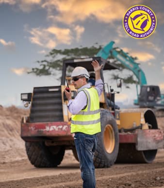 civil engineer leading construction equipment with radio communication